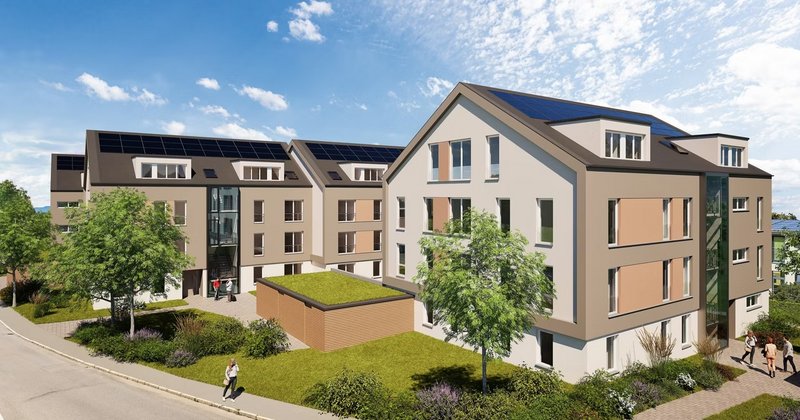 Wohnquartier mit grüner Architektur und Solartechnik Breite Perspektive auf eine Neubau-Wohnanlage mit begrünten Außenflächen, Solaranlagen und Fußwegen.